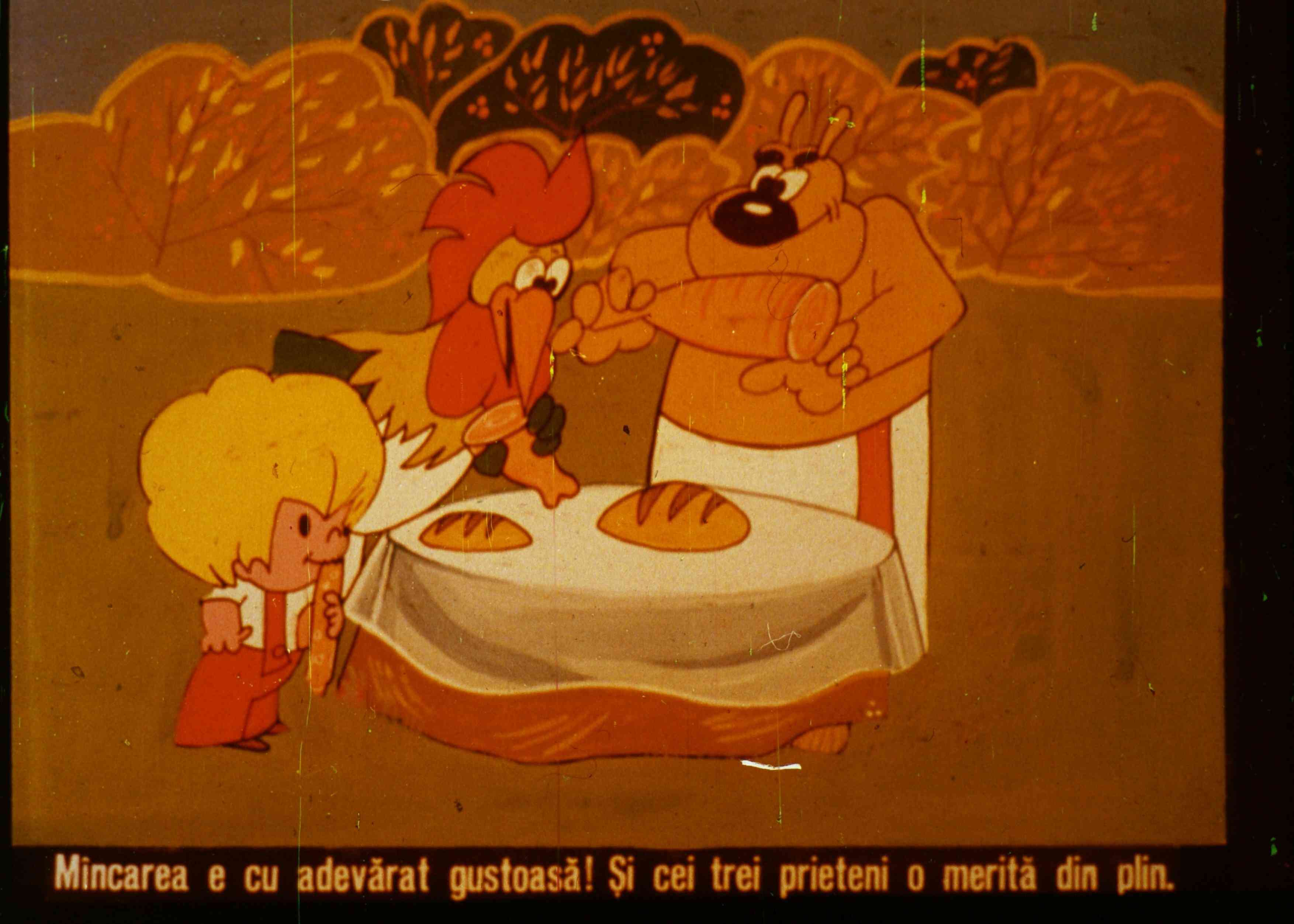 Imagine animată cu un pui, un câine și un copil, interacționând în jurul unei mese cu pâini, evidențiind importanța prieteniei și a mesei delicioase.